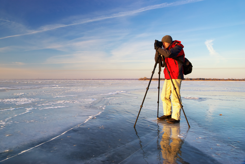 Travel photographer with a tripod