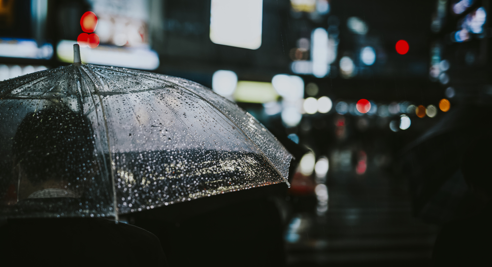 outdoor photography of a man walking at night